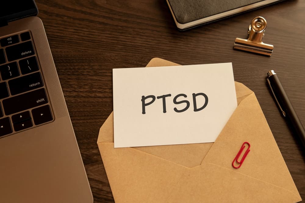 There is word card with the word PTSD. It is an abbreviation for Post-Traumatic Stress Disorder