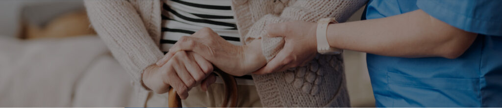 Nurse helping an elderly patient
