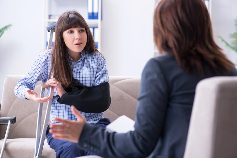 Woman who is dealing with a disability and asking an attorney about the difference between short-term disability and FMLA.