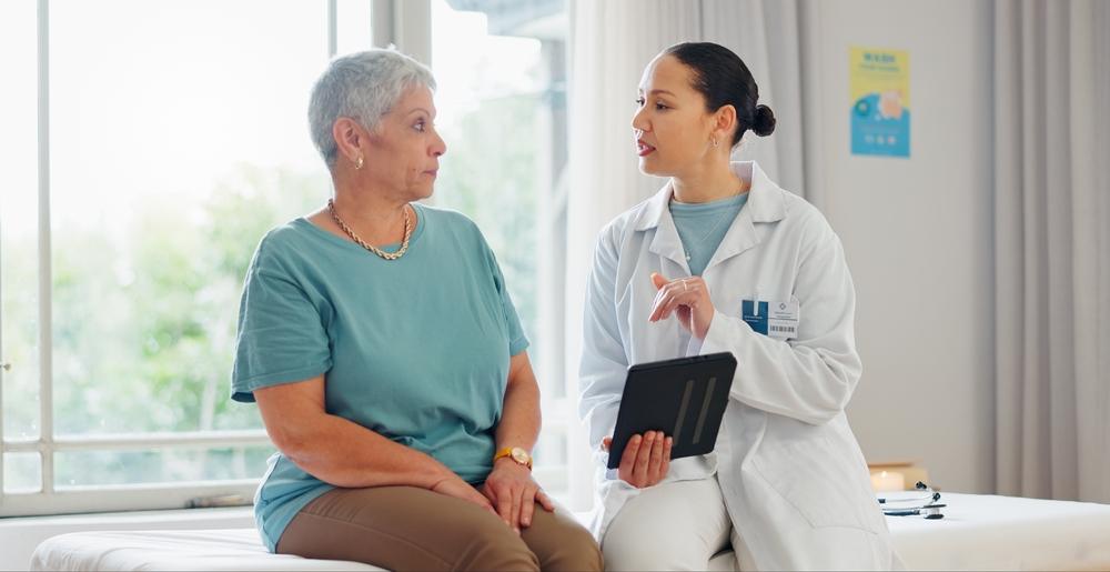 A woman diagnosed with an autoimmune disease discusses her medical needs with a doctor. Learn if you can get disability benefits if you suffer from an autoimmune disease.